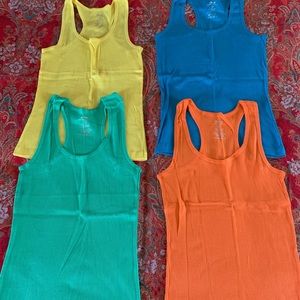 4  Tanks NWOT  ( orange , blue , yellow , green )